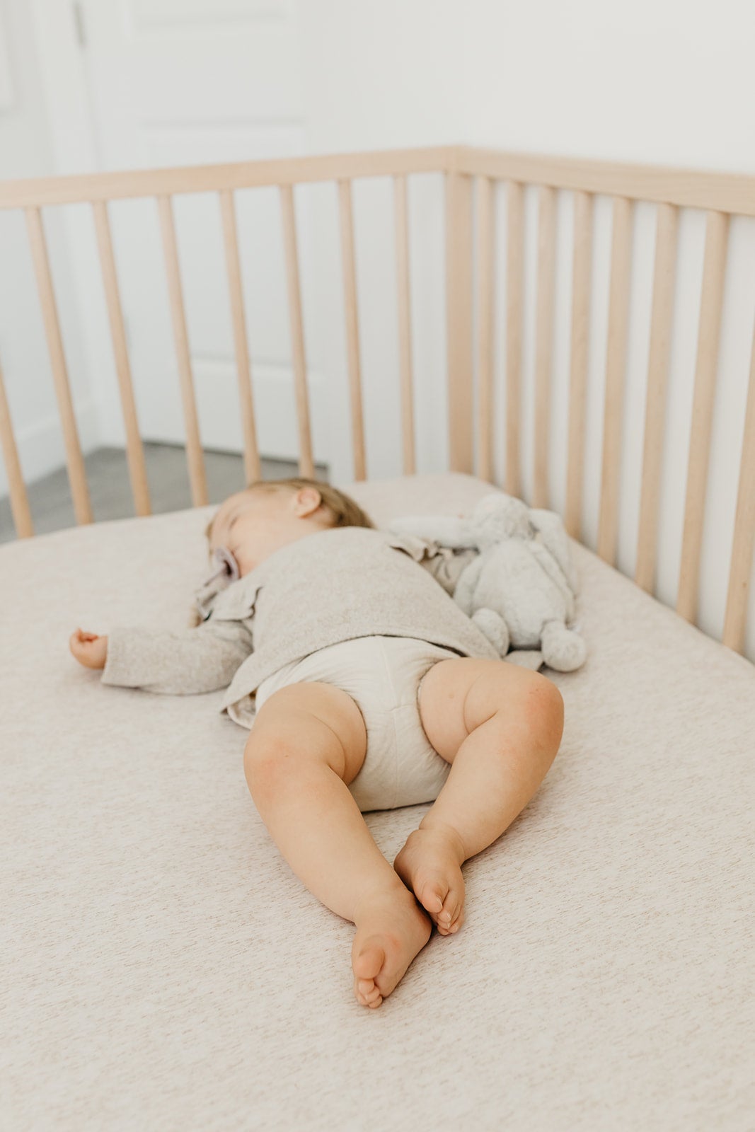 Copper Pearl premium knit fitted crib sheet in oat color, soft and snug for baby cribs, from My Store.