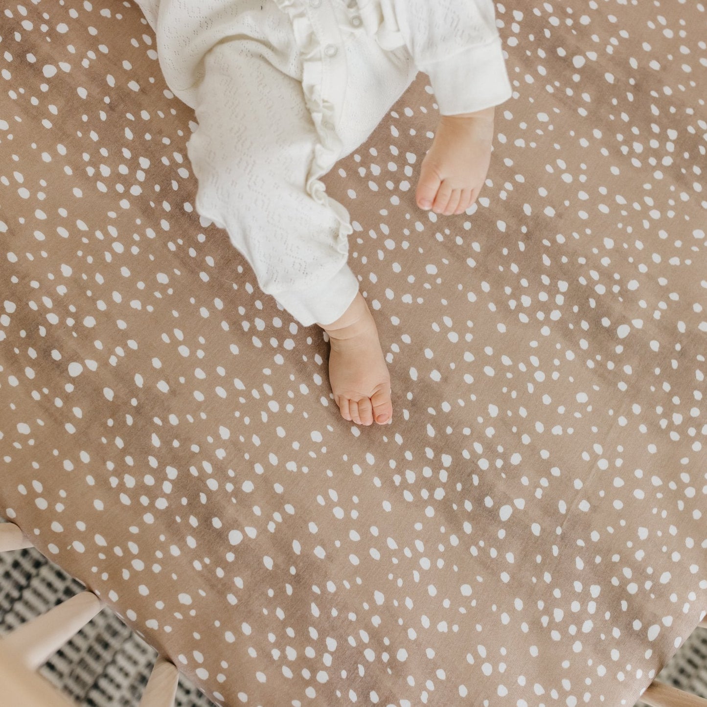 Copper Pearl premium knit fitted crib sheet in fawn color, soft and stretchy fabric perfect for baby cribs.