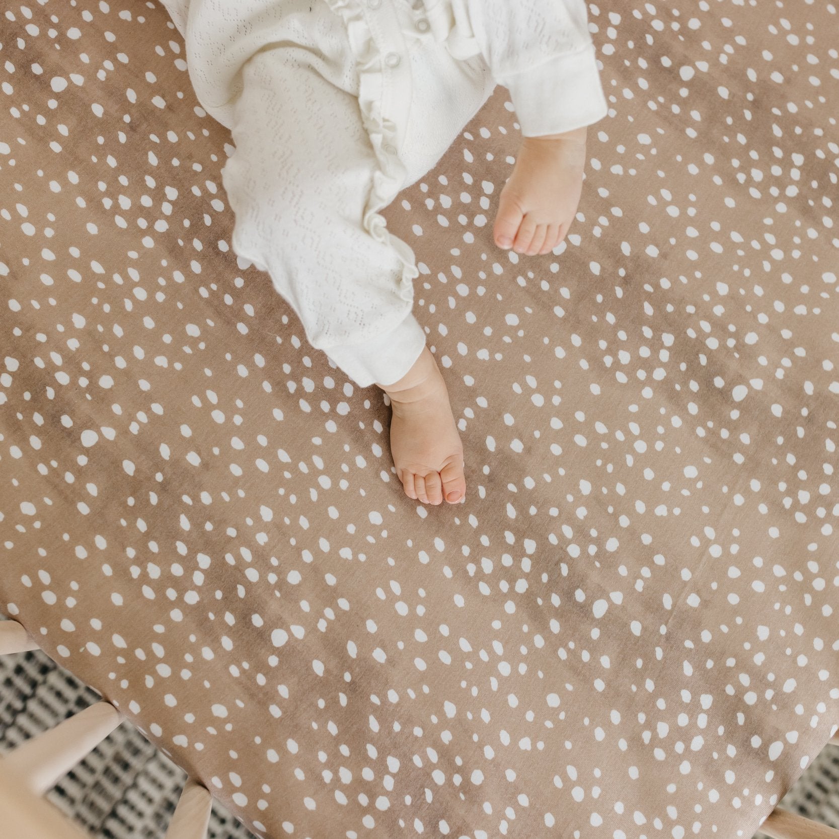Copper Pearl premium knit fitted crib sheet in fawn color, soft and stretchy fabric perfect for baby cribs.