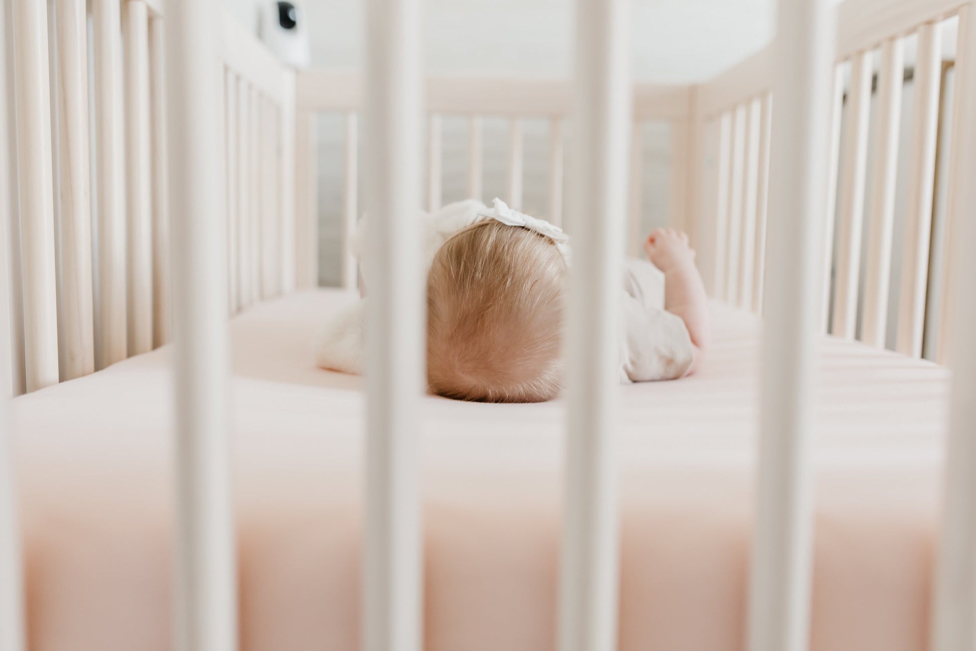 Copper Pearl blush knit fitted crib sheet with soft, cozy fabric and snug fit, perfect for baby cribs.