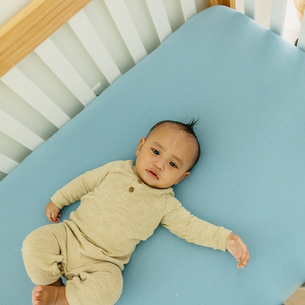 Copper Pearl Robin knit fitted crib sheet in soft, breathable fabric with a snug fit for a baby's crib.