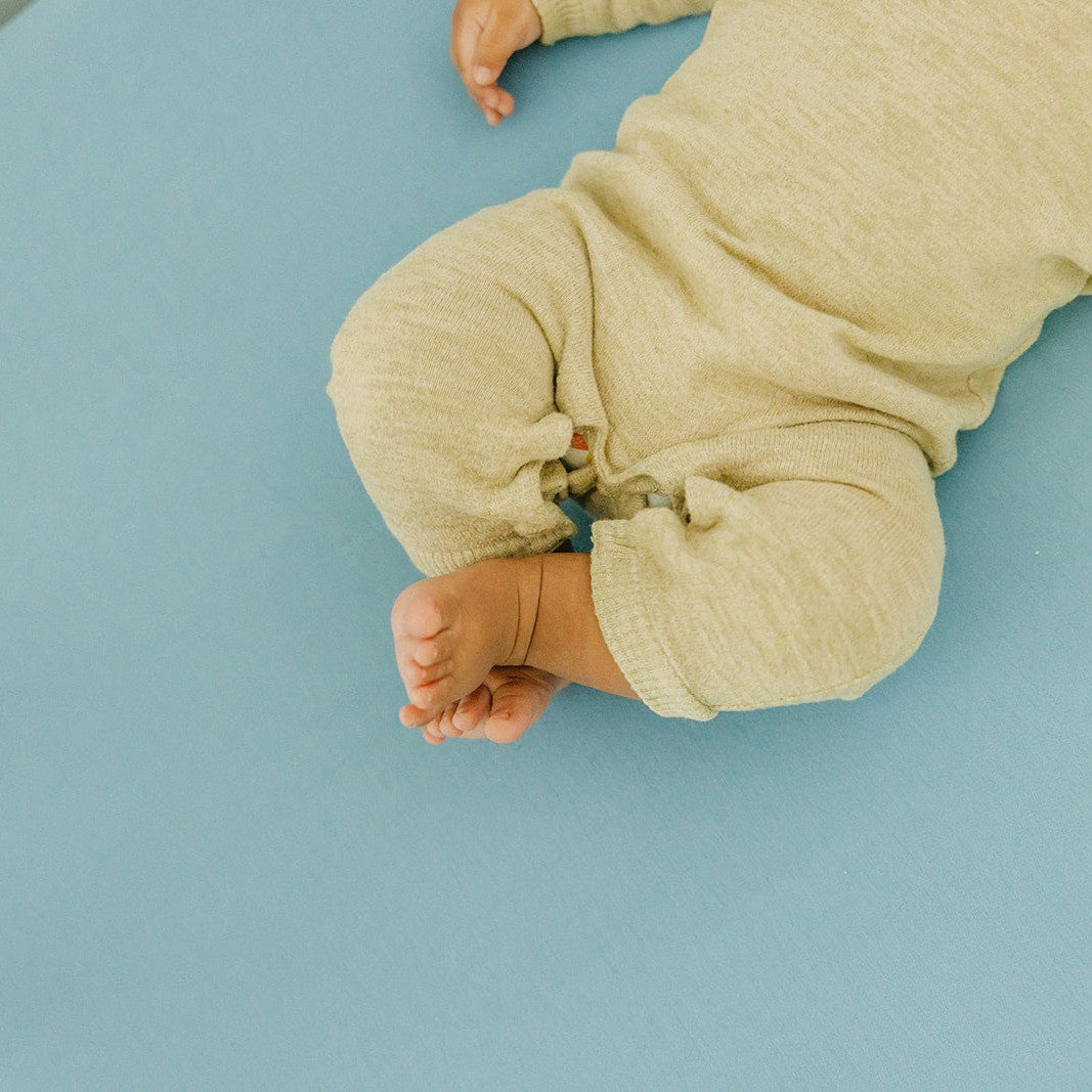Copper Pearl Robin knit fitted crib sheet in soft, breathable fabric with a cozy, snug fit for a baby crib.