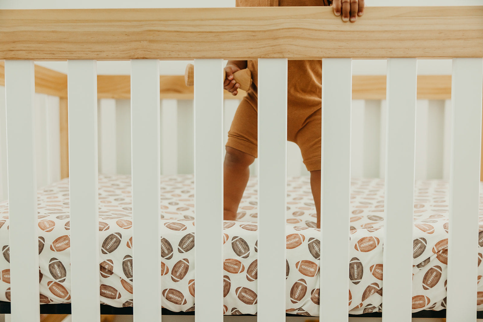 Copper Pearl premium knit fitted crib sheet in soft, breathable fabric with gentle elastic edges for a snug fit on a crib mattress.