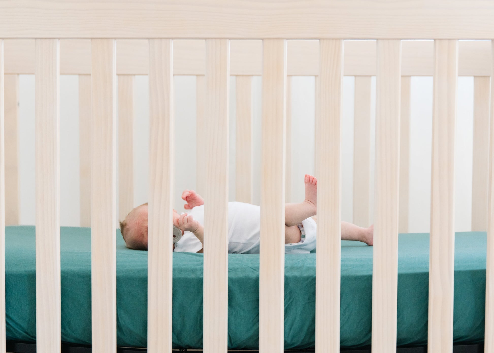 Copper Pearl Premium Knit Fitted Crib Sheet from Journey, soft and snug-fitting for baby cribs, in a cozy knit fabric.